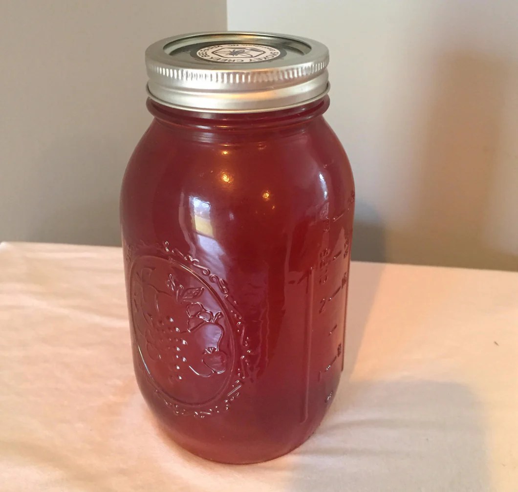 A store sells honey in 3/8 quart jars